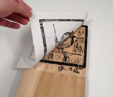 lift the paper from the block