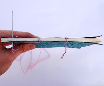 Stitch up through hole 1 again