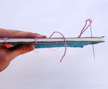 Sew down through hole 4