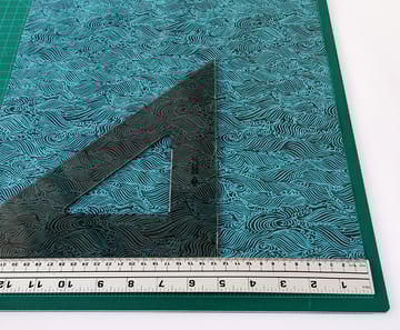 Cut the sheet of handmade paper into two 127x1524cm 5x6in long-grain sheets