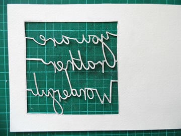 papercutting tricky letters cut out back view