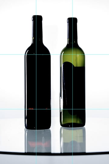 Two bottles balance the composition for still shots, but still allow room for dynamic arrangements.