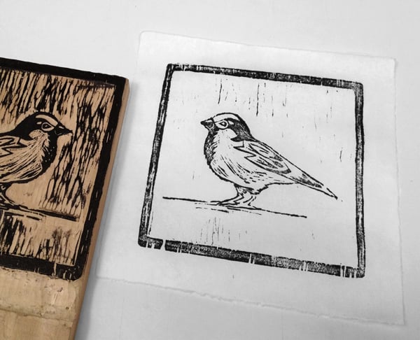 lift the paper from the block